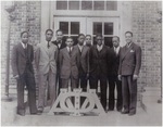 Black and white photograph printed on matte paper of Lloyd L. Gaines (second on left) with Alpha Phi Alpha fraternity brothers.